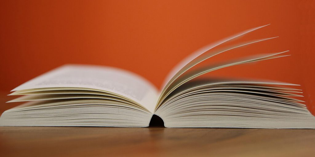 Open-book-on-wooden-table