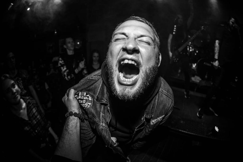 Black-and-white-photo-of-angry-punk-rocker-shouting